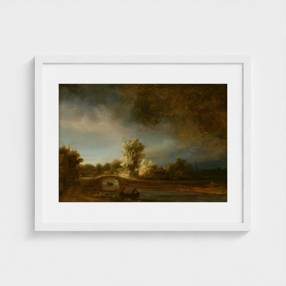 Landscape with a Stone Bridge by Rembrandt van Rijn in a white frame